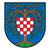 Logo von Birkenfeld. Ein blauer Hintergrund mit einem Baum. In der Mitte ein weiß-rot kariertes Schild