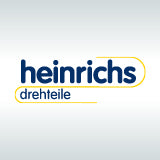 Logo von heinrichs auf grauem Hintergrund.
